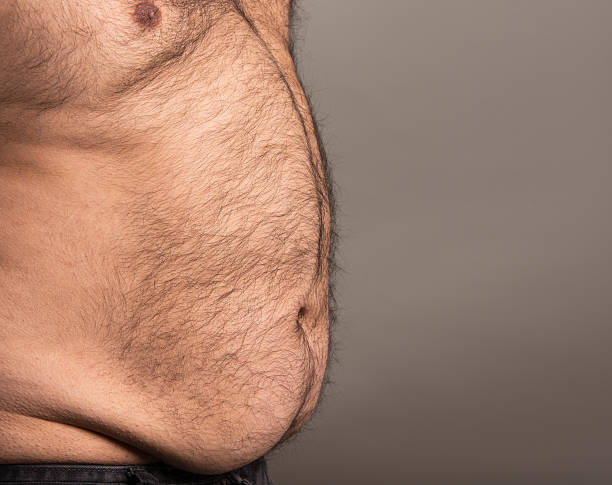 image of overweight mans stomach - fat hairy man stock pictures, royalty-fr...