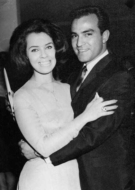 Image taken in the 60s - hispanic young man posing with his caucasian young girlfriend Black and white Image taken in the 60s - hispanic young man posing with his caucasian young girlfriend 1964 stock pictures, royalty-free photos & images