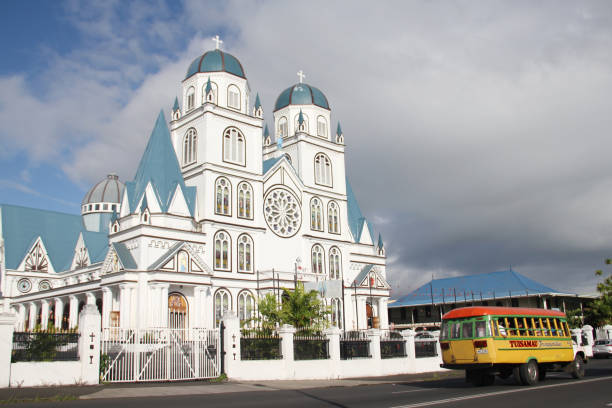 Immaculate Conception of Mary Cathedral Exterior of Immaculate Conception of Mary Cathedral, Apia, and a local bus passing in front of it. Located in the center of the capital city, Apia, you will find this beautiful church with stained glass and art on the walls. apia samoa stock pictures, royalty-free photos & images