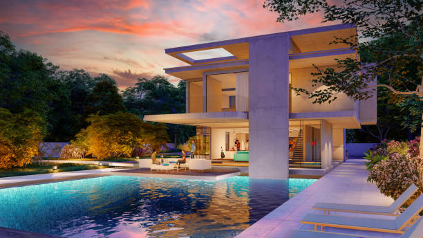 Impressive modern  mansion with pool at dusk stock photo