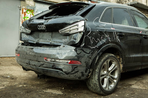 AUDI Q3 in black after an accident. Accident hit from behind with displacement to the right side. Back view. stock photo