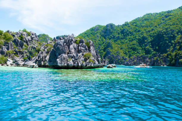 In order to see the lagoons, small islands, cliffs and many natural beauties on the island of Palawan, you need to take tours with private boats. In order to see the lagoons, small islands, cliffs and many natural beauties on the island of Palawan, you need to take tours with private boats.You can see great destinations on these tours. asian beauties stock pictures, royalty-free photos & images