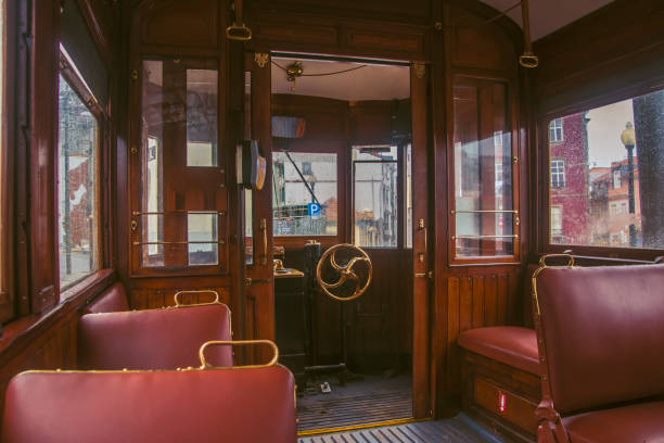in the car of an old tram. seats for passengers and control cabin - carro oporto imagens e fotografias de stock
