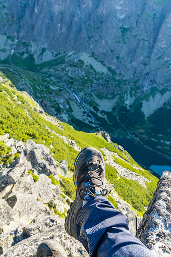 Tatranska Polianka, Slovakia - July 03, 2022: In the mountains suitable shoes and pants, such as those from the manufacturer Mammut (Kento Low GTX, Eisfeld Light SO Pants) are recommended for trips.