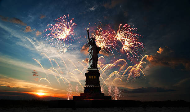 Independence day. Liberty enlightening the world Statue of Liberty on the background of sunrise and fireworks fireworks 4th of july stock pictures, royalty-free photos & images