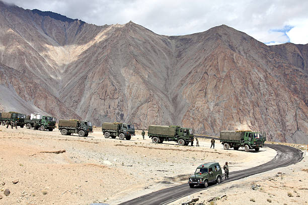 Indian army convoy of trucks Jammu & Kashmir, India - September 4, 2011: Indian army convoy of trucks delivering supplies to remote military installations in Himalayas ladakh region stock pictures, royalty-free photos & images