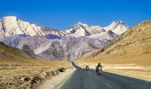 Indian bikers travel on national highway with scenic landscape at Ladakh India. stock photo