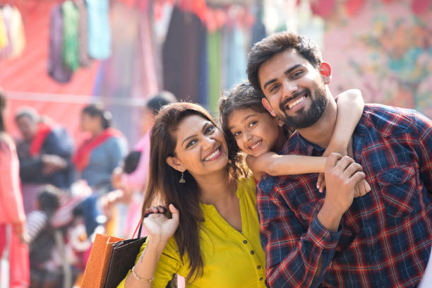 Happy Indian family at street market