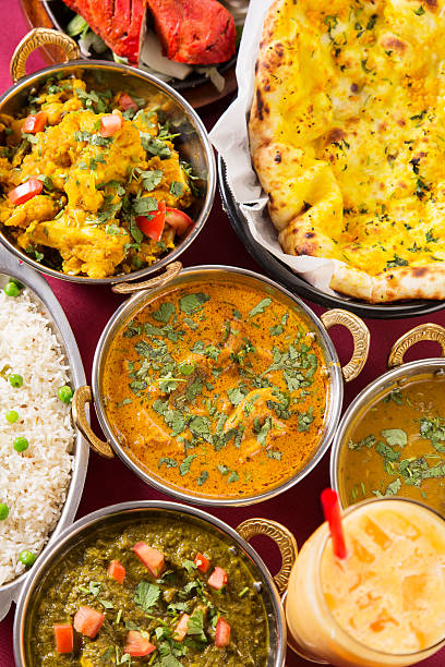 Indian food: assortments of dishes Indian food: assortments of dishes including dal makhni, allo gobi, saag paneer, chicken tikka masala, basmati rice, naan bread,  vegetable curry and mango lassi. You might also be interested in these: curry meal stock pictures, royalty-free photos & images