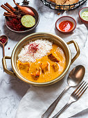 Indian Food Chicken Tikka Masala in metal bowl with rice