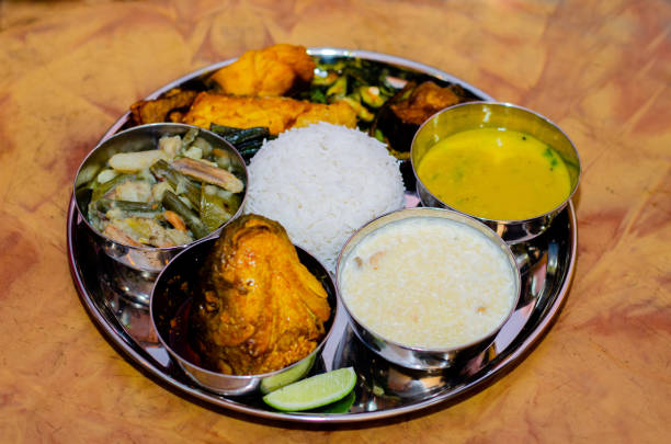 Indian food thali, Bengali food. Indian food thali containing rice , fish, dal,kheer and different vegetables in plate. Traditional Bengali food. bengali sweets stock pictures, royalty-free photos & images