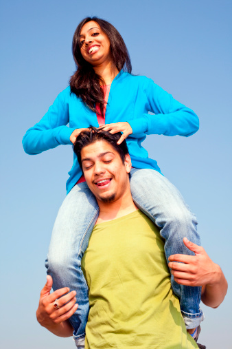 Indian Male Carrying Female Friend On Shoulder Giving Head