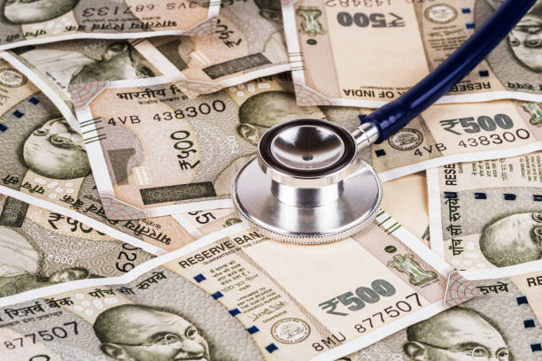 Indian new five hundred rupees bills and stethoscope stock photo
