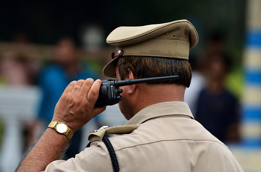 Calcutta, India - August 15, 2014: Indian police with walkie talkie. Police squad the place with walkie talkie.