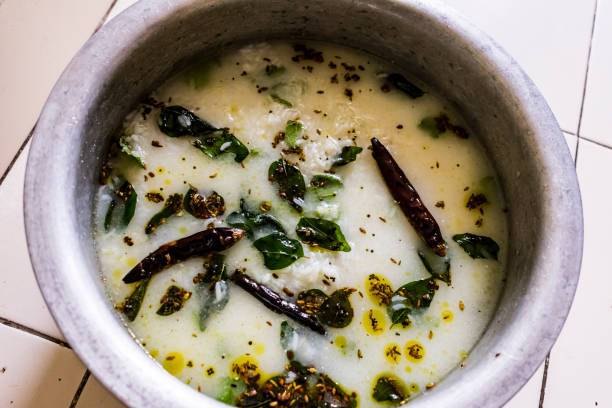 indian special food brinjal curd curry with awesome taste looking awesome in oil fried by curry leafs, red chili, cumin, mustard seeds, Fenugreek seed. stock photo