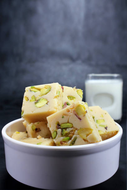 Indian Sweet milk burfi,Mawa Burfi or Khoya burfee Milk burfi or mawa burfi is very popular Indian sweet or Mithai made from milk,sugar and desi ghee and dryfruits to celebrate festivals or family functions. mithai stock pictures, royalty-free photos & images