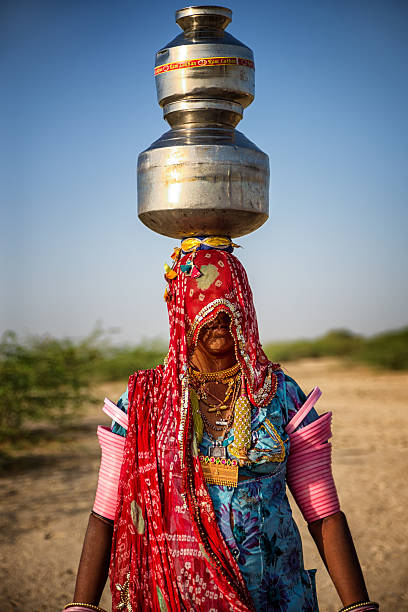 Best Indian Women Carrying Water On Head Stock Photos, Pictures
