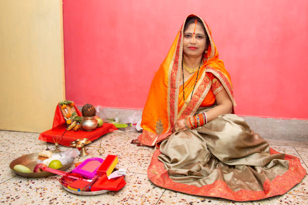 Indian woman celebrating festivals North Indian woman celebrating Hindu festival like Teej or Karwa chauth. chhath stock pictures, royalty-free photos & images