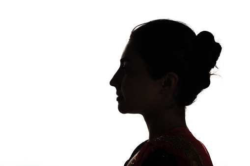 Indian young adult woman profile view silhouette portrait.