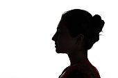 istock Indian young adult woman profile view silhouette portrait 1328752384