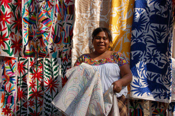 Indigenous Woman Posing With Her Textiles. stock photo