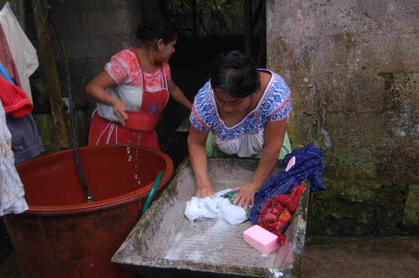 Indigenous Women Washing Clothes stock photo