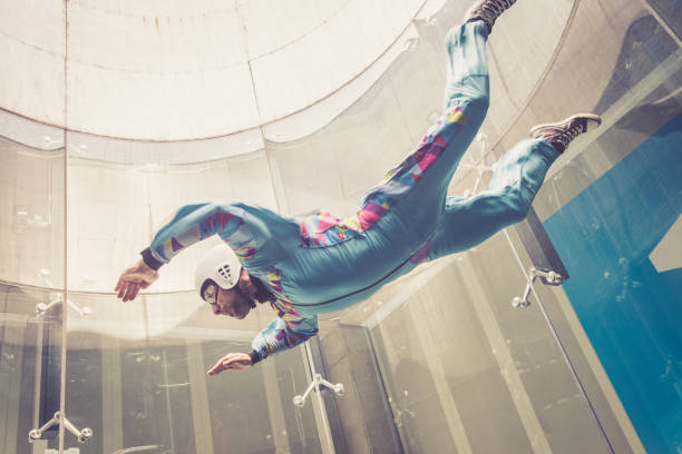 Indoors skydiving - flying - extreme sports point of view - freefall simulation stock photo