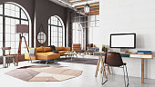 istock Industrial Style Loft Living Room with Blank Screen Computer Workspace and Cozy Furnitures 1400417490