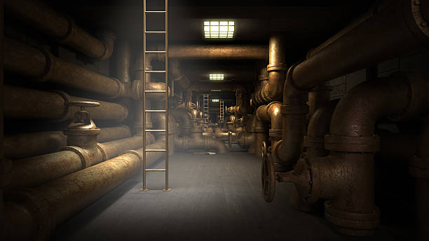 Industrial underground tunnel with piping system. stock photo