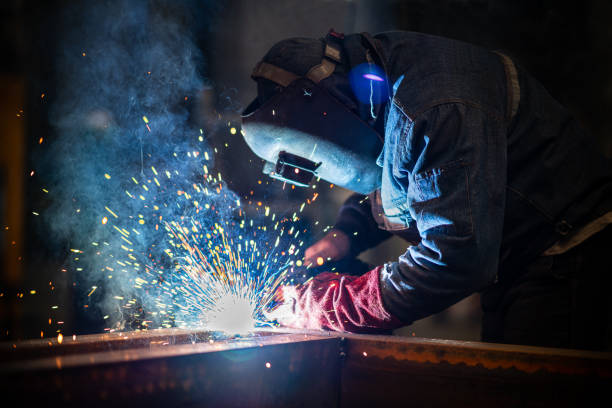 Industrial Welder With Torch Industrial Welder With Torch blacksmith stock pictures, royalty-free photos & images