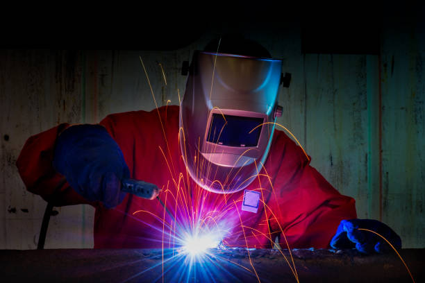 Industrial Worker at the factory welding closeup Industrial Worker at the factory welding closeup af_istocker stock pictures, royalty-free photos & images