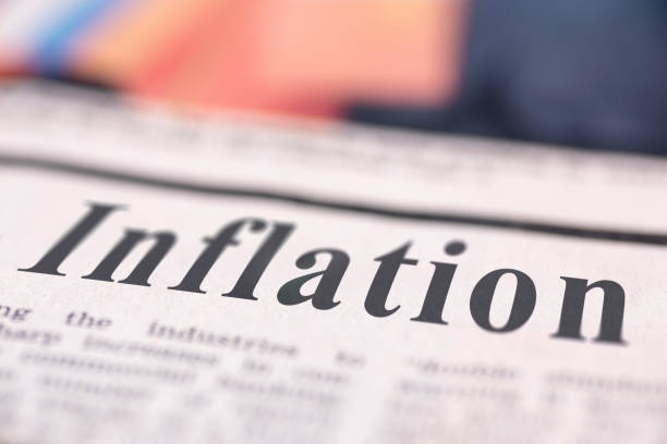 Inflation written newspaper Inflation written newspaper close up shot to the text. inflation stock pictures, royalty-free photos & images