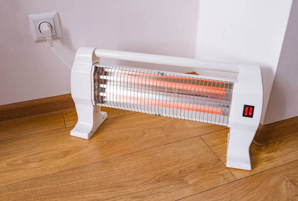 Infrared halogen electric heater at home Infrared halogen electric heater at home halogen light stock pictures, royalty-free photos & images