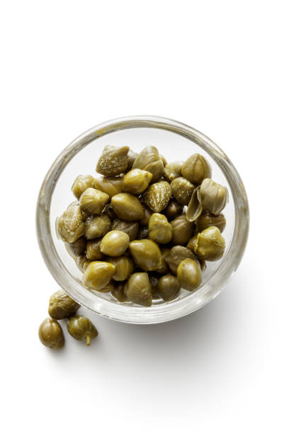 Ingredients: Capers Isolated on White Background Ingredients: Capers Isolated on White Background caper stock pictures, royalty-free photos & images