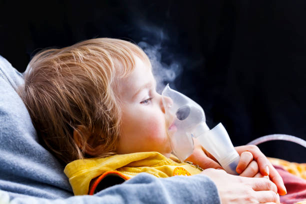 Inhalation child infant under one year stock photo