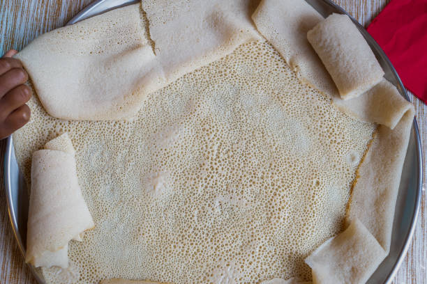 Injera, a sourdough flatbread made from teff flour. stock photo