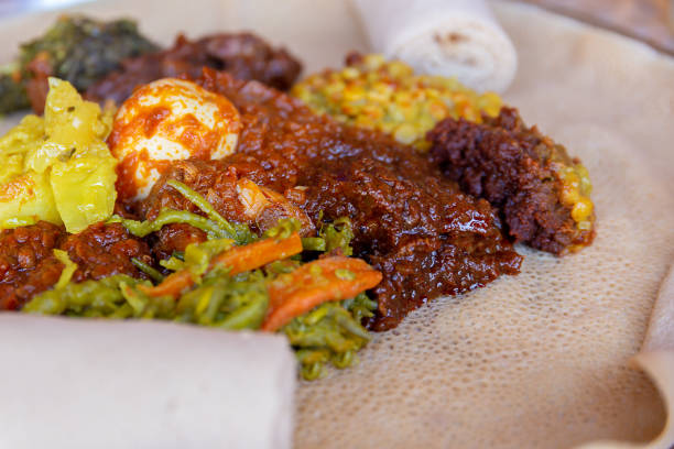 Injera with an assortment of toppings stock photo