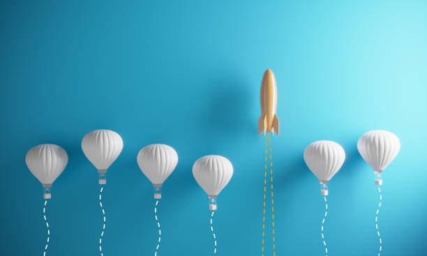 Innovation - Standing Out From The Crowd Orange colored rocket rising on the top between the hot air balloons. ( 3d render ) skill stock pictures, royalty-free photos & images
