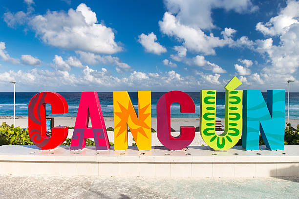 CANCUN inscription in front of the Delfines beach stock photo