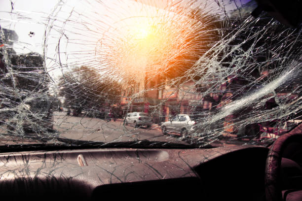 Inside of car with the broken windshield during road accident stock photo