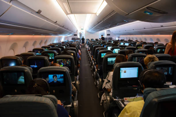 Inside the economy class in flight of Cathay Pacific Airbus 350-900 stock photo