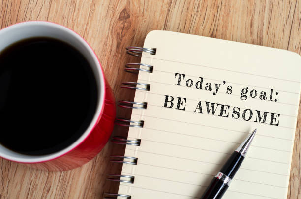 Inspirational Quote - Today's Goal, Be Awesome Today's goal - Be awesome text on notepad with pen and a cup of coffee, wooden background happy friday stock pictures, royalty-free photos & images