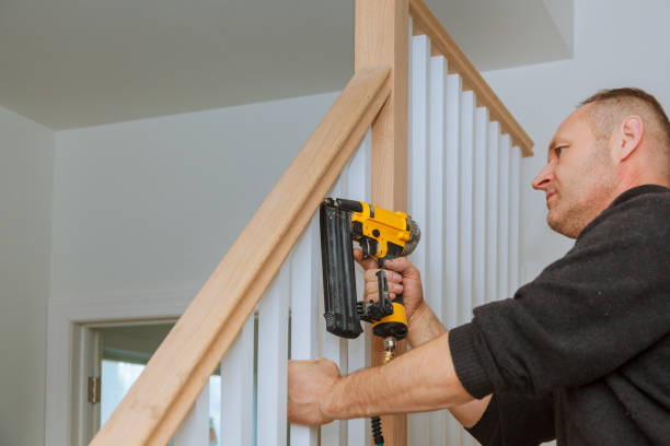 Installation nailing the railing for stairs with an air gun wooden railing How to Install a nailing the railing for stairs with an air gun bannister stock pictures, royalty-free photos & images