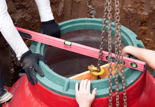 Installation of underground tank for sewage system stock photo