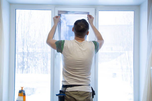 Installation of window film in the office. stock photo
