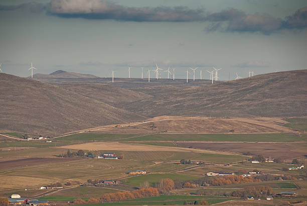 Traditional Farms and Wind Farm in the Distance Installed wind power capacity in Washington State has grown in recent years and the state now ranks among the top ten in the nation with the most wind power installed. As of 2016, wind energy accounted for 7.1% of all energy generated in Washington State. These turbines operate in the Kittitas Valley near Ellensburg, Washington State, USA. jeff goulden wind energy stock pictures, royalty-free photos & images