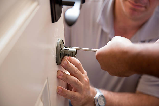 Installing a lock and security system Installing a lock and security system.  rr locksmith stock pictures, royalty-free photos & images