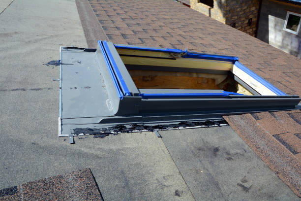 Installing Skylights windows in unfinished bitumen roof shingles. stock photo
