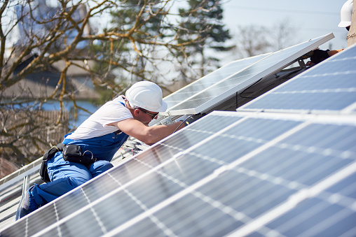 Installing Solar Photovoltaic Panel System On Roof Of House Stock Photo Download Image Now