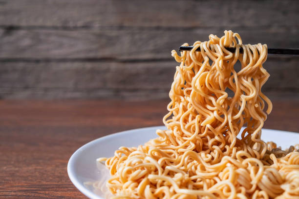 Instant noodles on a plate on the table stock photo